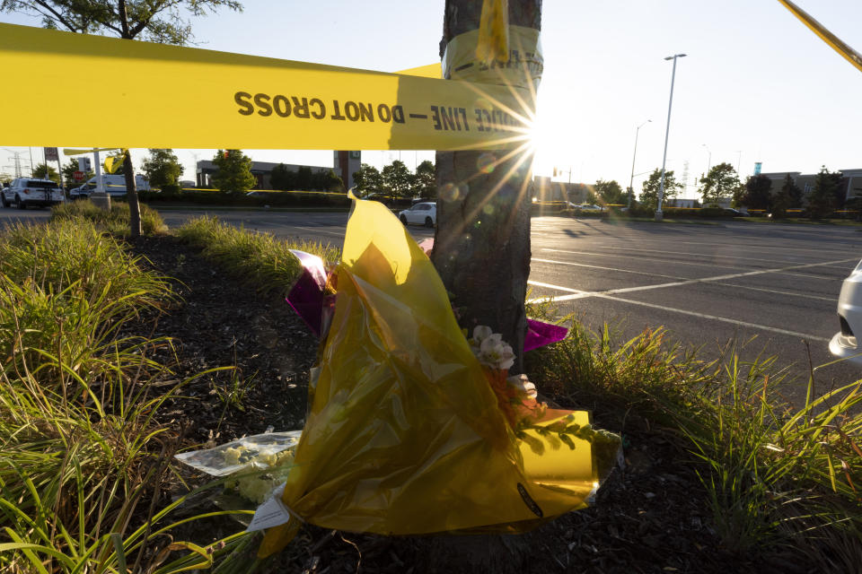 Flowers are laid to pay respects to a police officer who was killed at the scene of a shooting in Mississauga, Ontario, Monday, Sept. 12, 2022. (Arlyn McAdorey/The Canadian Press via AP)