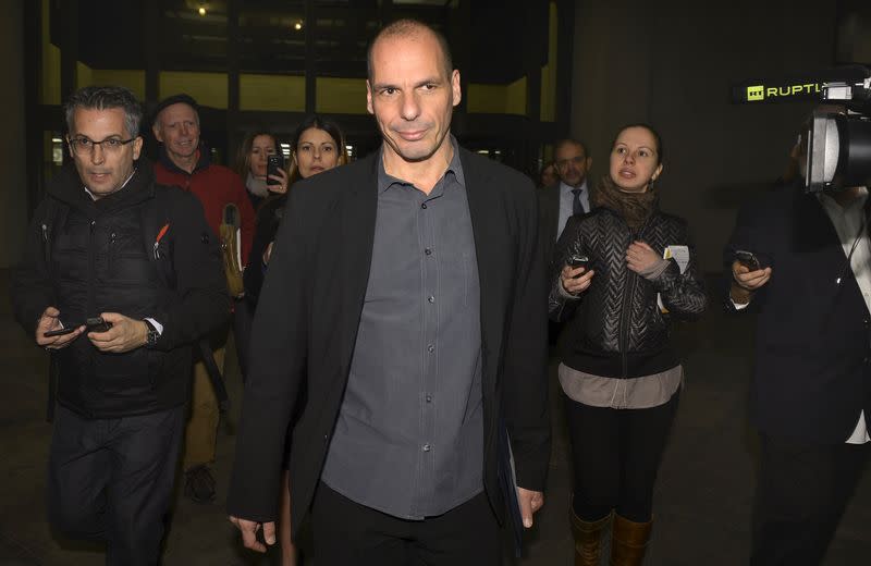 Greek Finance Minister Yanis Varoufakis is surrounded by members of the media as he finishes comments on the "informal discussions" he just concluded with the International Monetary Fund Managing Director Christine Lagarde, in Washington, April 5, 2015. REUTERS/Mike Theiler