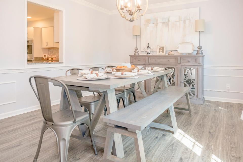 The dining room features a pass-though window to make it easier to send food from the kitchen.