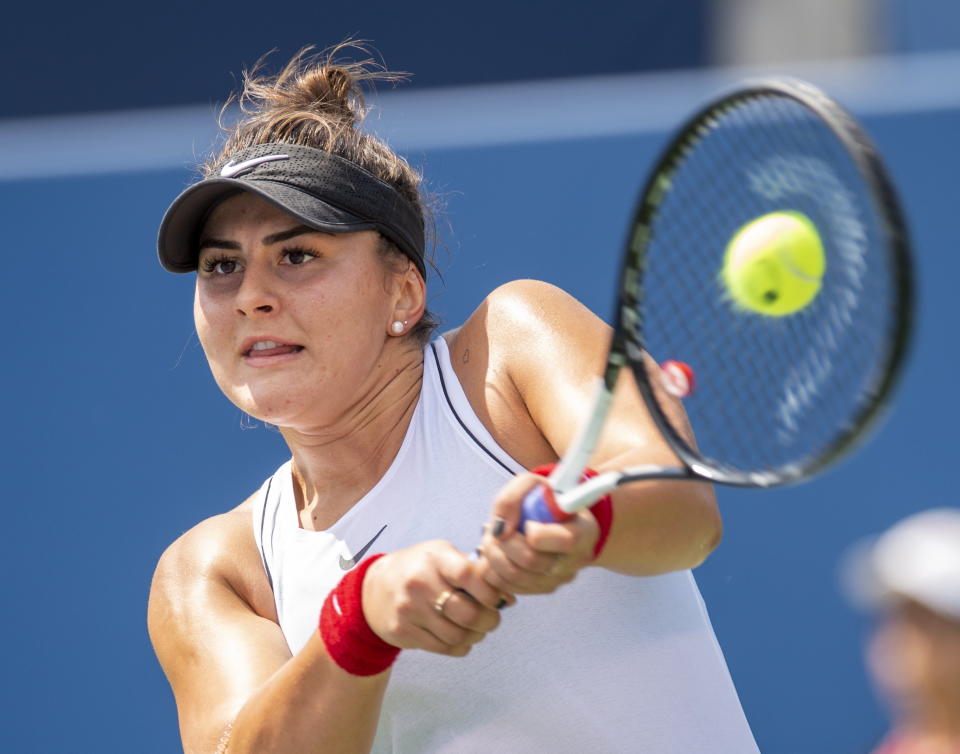Bianca Andreescu of Canada hits a backhand to Kiki Bertens of the Netherlands during the Rogers Cup women’s tennis tournament Thursday, Aug. 8, 2019, in Toronto. (Frank Gunn/The Canadian Press via AP)