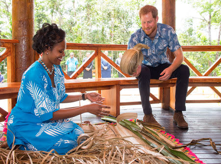 Britain's Prince Harry watches a demonstration of traditional mat weaving as he attends a dedication of the Colo-i-Suva forest to the Queen's Commonwealth Canopy in Suva, Fiji, October 24, 2018. Dominic Lipinski/Pool via REUTERS