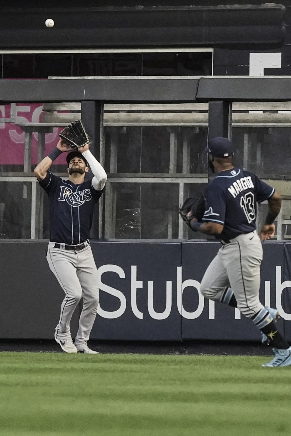 Tampa Bay Rays center fielder Kevin Kiermaier catches an out during third inning of a baseball game against New York Yankees, Tuesday June 14, 2022, in New York. (AP Photo/Bebeto Matthews)