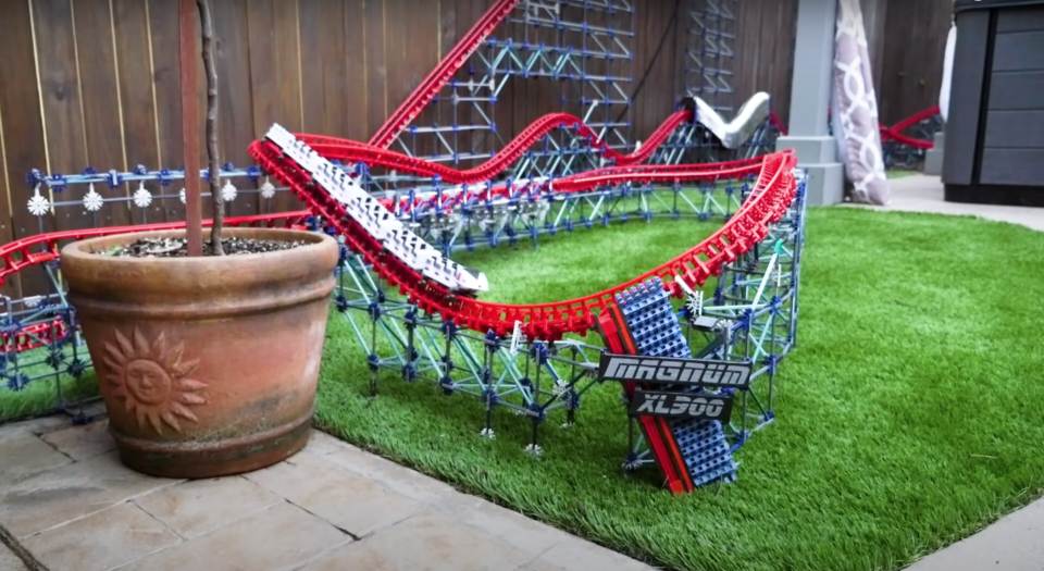 Model maker, CoasterWriter, has built a ten-foot-tall backyard-sized K'nex roller coaster, and the mini ride is endless fun to watch.