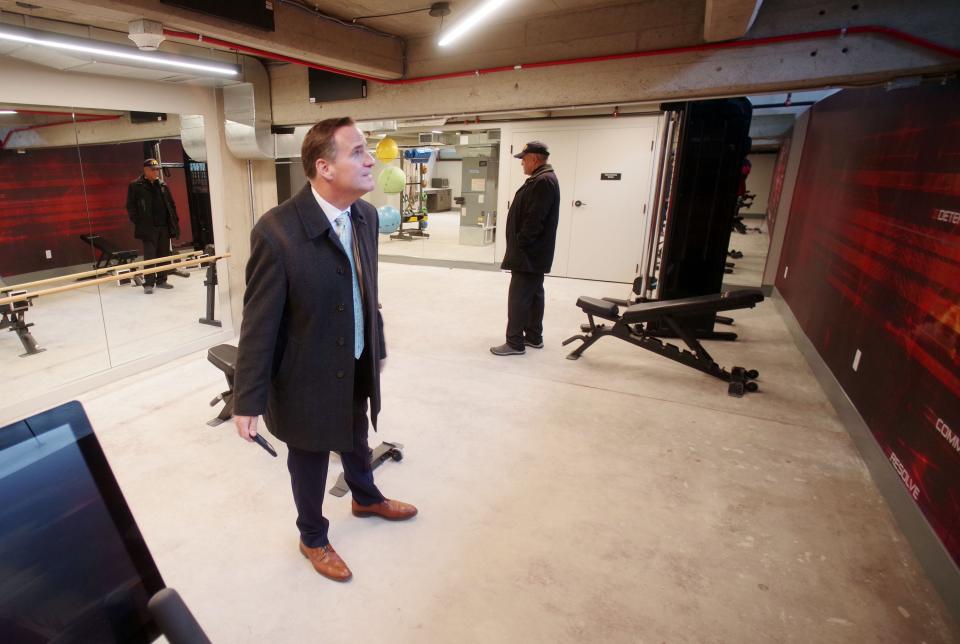 Metro South Chamber of Commerce President and CEO Chris Cooney, left, and Brockton City Council President Moises Rodrigues inspect the basement gym in the renovated "Furniture Building" 93 Centre St. in Brockton on Tuesday, March 26, 2024.