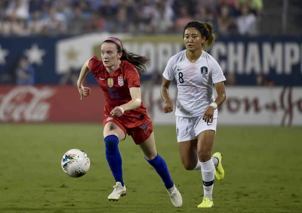 File-This Oct. 3, 2019, file photo shows United State's Rose Lavelle, left, dribbles past South Korea's Cho So-hyun, right, during a soccer match in Charlotte, N.C. Lavelle scored a goal in a World Cup final win over the Netherlands. Could be a big factor for the Americans at the Tokyo Games. (AP Photo/Mike McCarn, File)