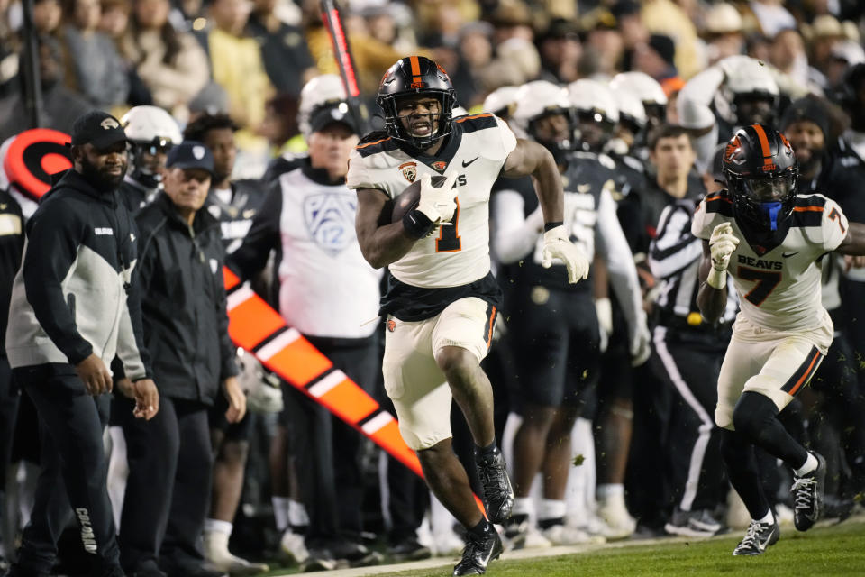 Oregon State running back Deshaun Fenwick carries during the second half of the team's NCAA college football game against Colorado on Saturday, Nov. 4, 2023, in Boulder, Colo. (AP Photo/David Zalubowski)