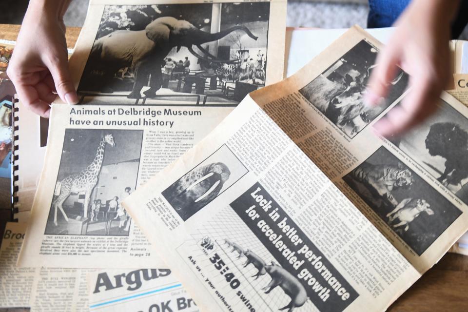 A pile of newspaper clippings from Henry Brockhouse’s past history creating taxidermy in Sioux Falls, South Dakota on Thursday, August 24, 2023.
