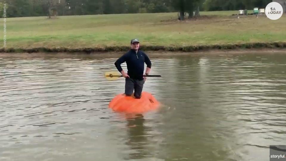 Farmer converts giant pumpkin into a boat, floats across pond