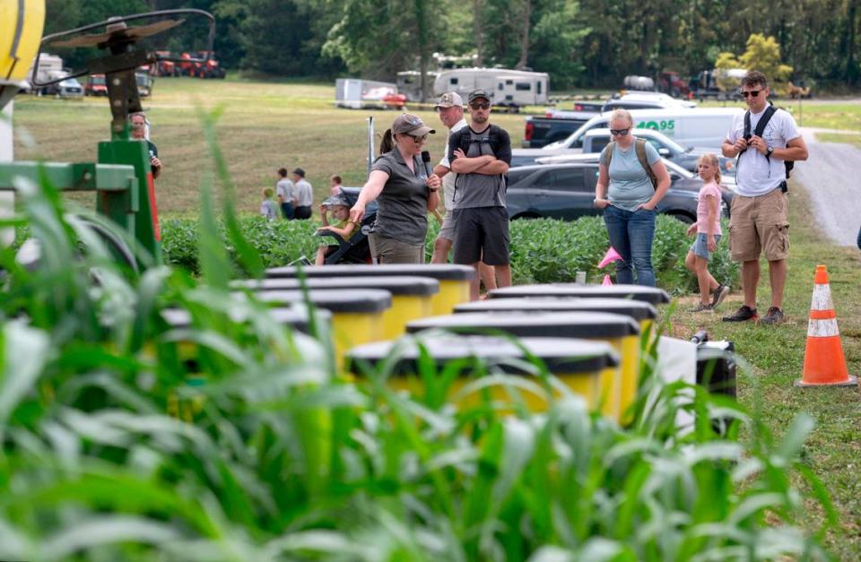 Visitors listen to a demonstration about cover crop planting at Penn State’s Ag Progress Days on Tuesday, Aug. 9, 2022.