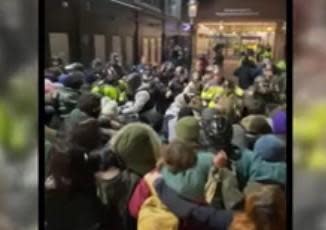 Confrontation between police and pro-Palestinian protesters at Boston's Emerson College early on April 25, 2024. / Credit: Henry De Groot / DSA Working Mass