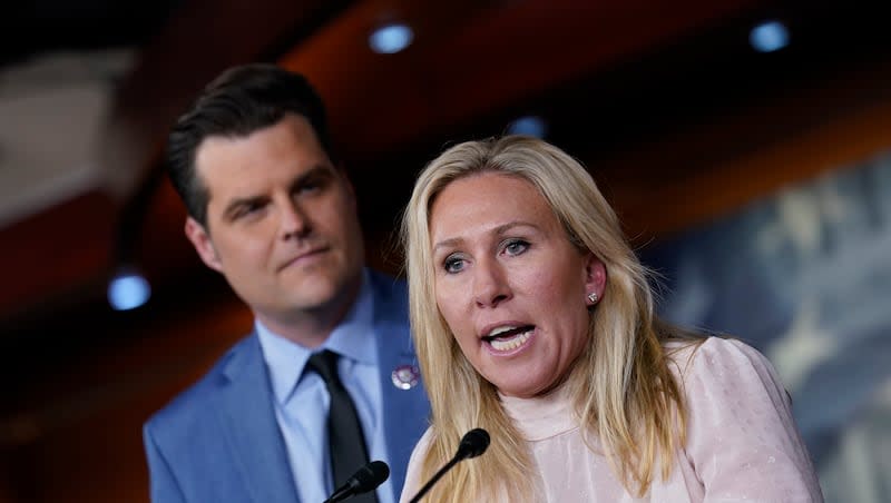 Rep. Marjorie Taylor Greene, R-Ga., joined at left by Rep. Matt Gaetz, R-Fla., speaks at a news conference about the treatment of people being held in the District of Columbia jail who are charged with crimes in the Jan. 6 insurrection, at the Capitol in Washington, Tuesday, Dec. 7, 2021.