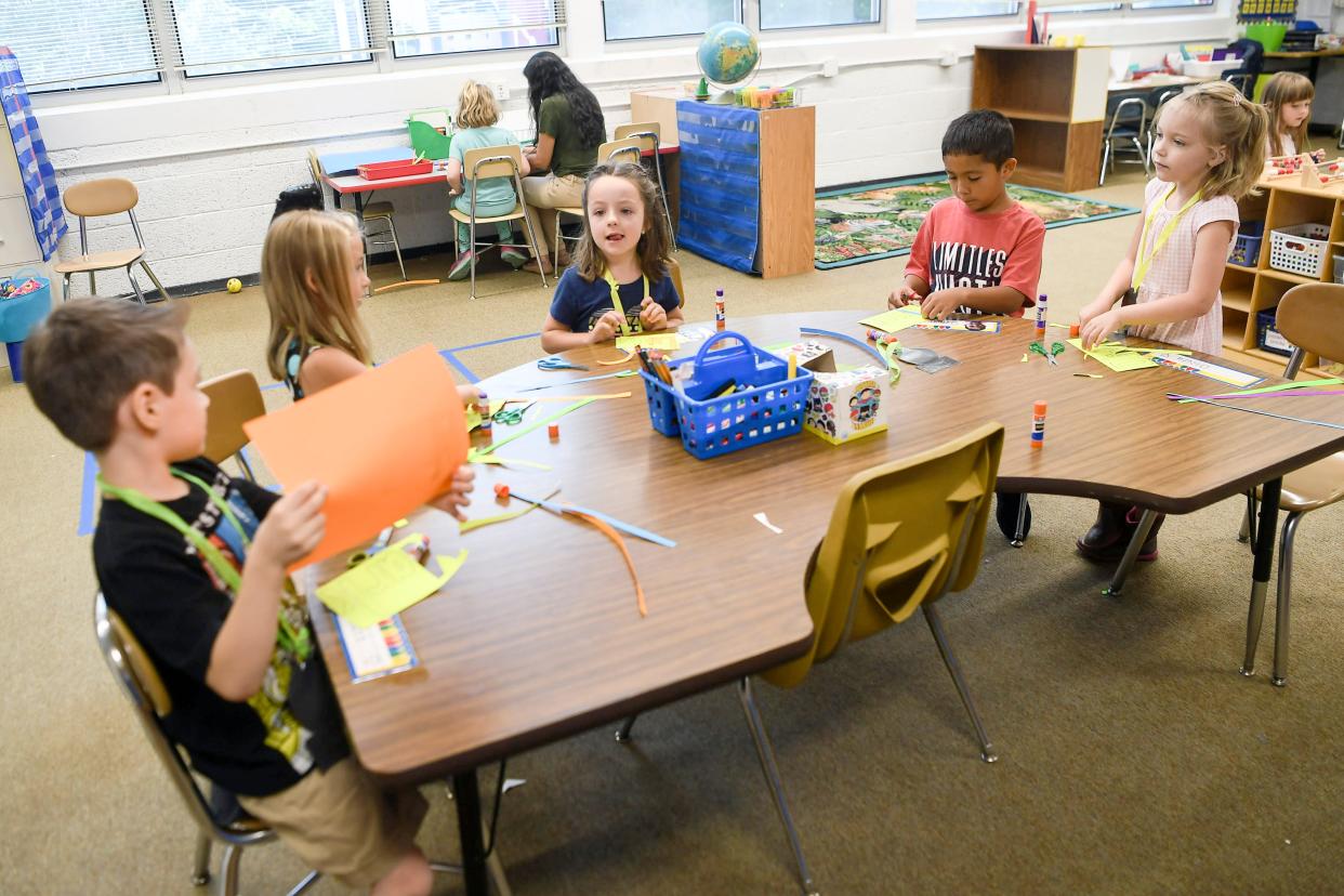 First-graders in Ana Esparza's Spanish immersion dual language class made name tags on their first day of school at Candler Elementary.