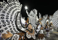 Dancers from the Tom Maior samba school perform during a carnival parade in Sao Paulo, Brazil, Saturday, April 23, 2022. (AP Photo/Andre Penner)