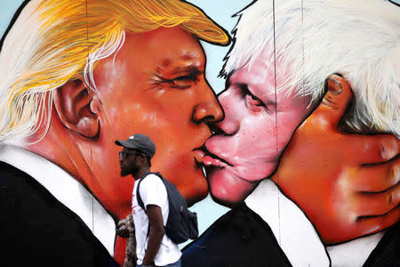 A mural of Donald Trump embracing Boris Johnson is seen on a building in Bristol, Britain May 24, 2016. REUTERS/Peter Nicholls/File Photo