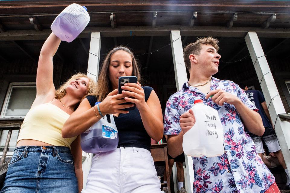University of Delaware juniors Tiana Pritzlaff, Ellie Crane both 21, with their BORGs at a house party in Newark on Saturday, May 20, 2023.