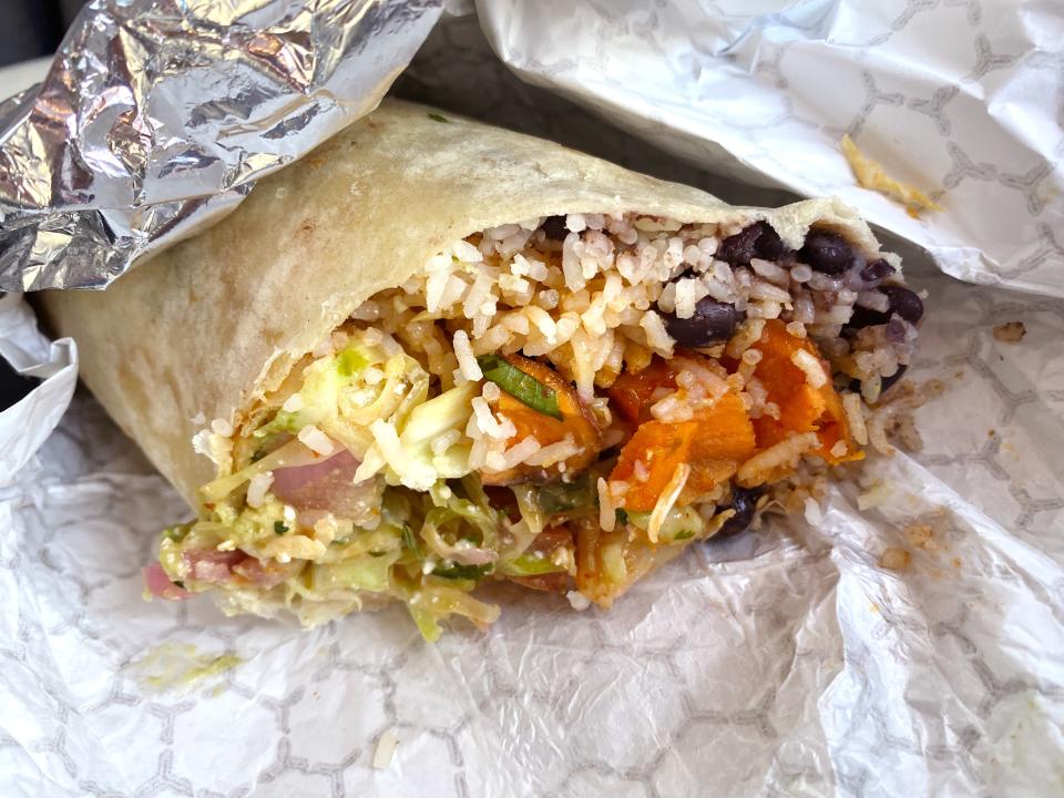 Veggie burrito with flour tortilla, black beans, cilantro lime rice, cabbage, roasted seasonal vegetables and guacamole from Mochilero Kitchen in Peoria.