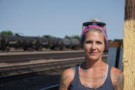 In this Thursday, Sept. 5, 2019 photo Blackjewel warehouse technician Melissa Worden, poses for a photo in Gillette, Wyo. The shutdown of Blackjewel LLC's Belle Ayr and Eagle Butte mines in Wyoming since July 1, 2019 has added yet more uncertainty to the Powder River Basin's struggling coal economy. (AP Photo/Mead Gruver)