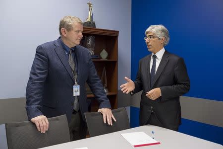 Michael Bennett (L), senior vice president and general counsel in the litigation division of Wal-mart Stores, and Theodore J. Boutrous, Jr., counsel with Gibson, Dunn and Crutcher in Los Angeles, meet at the Wal-mart headquarters in Bentonville, Arkansas November 4, 2014. REUTERS/Marc F. Henning