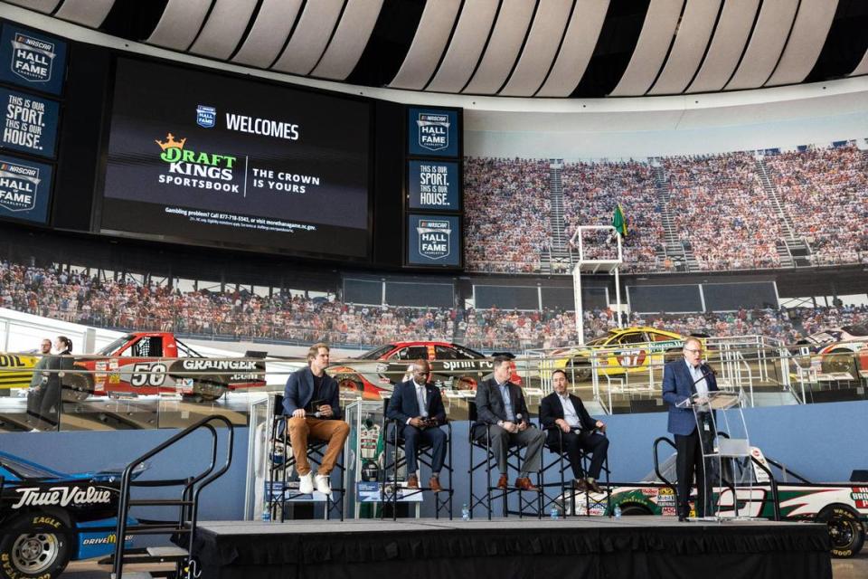 Panthers legend Greg Olsen, North Carolina State Representative Zack Hawkins, representatives from DraftKings and NASCAR speak before the first bet is made as sports betting goes live in North Carolina at NASCAR Hall of Fame in Charlotte, N.C., on Monday, March 11, 2024.