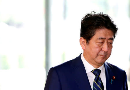 FILE PHOTO: Japan's Prime Minister Shinzo Abe arrives at his office in Tokyo, Japan July 3, 2017. REUTERS/Kim Kyung-Hoon/File Photo