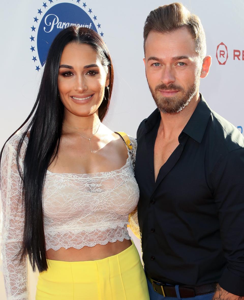 The <em>Total Bellas </em>star had no problem <a href="https://people.com/tv/nikki-bella-sex-life-with-artem-chigvintsev/" rel="nofollow noopener" target="_blank" data-ylk="slk:dishing about her sex life;elm:context_link;itc:0;sec:content-canvas" class="link ">dishing about her sex life</a> on <em>The Bellas Podcast </em>with her sister, Brie Bella. When a fan asked how often she and her boyfriend, <a href="https://people.com/tv/artem-chigvintsev-wont-watch-dwts-season-28/" rel="nofollow noopener" target="_blank" data-ylk="slk:Dancing with the Stars alumnus Artem Chigvintsev;elm:context_link;itc:0;sec:content-canvas" class="link "><em>Dancing with the Stars </em>alumnus Artem Chigvintsev</a>, get it on, Nikki didn't hold back. She told the fan, “Artem and I have an amazing sex life.” “When they say dancers are the best, let me tell ya: Once you have a dancer, you don’t go back. That’s it,” she said of Chigvintsev, whom <a href="https://people.com/tv/nikki-bella-ran-away-artem-chigvintsev-first-date/" rel="nofollow noopener" target="_blank" data-ylk="slk:she's been dating since March 2019;elm:context_link;itc:0;sec:content-canvas" class="link ">she's been dating since March 2019</a>. The couple met while partnered on <em>Dancing with the Stars</em> (while Nikki was still <a href="https://people.com/tv/nikki-bella-still-cries-over-john-cena-split/" rel="nofollow noopener" target="_blank" data-ylk="slk:connected to John Cena;elm:context_link;itc:0;sec:content-canvas" class="link ">connected to John Cena</a>) and reconnected after her breakup, making their relationship official in July 2019. She joked, “If he leaves me, I’m going to the ballet every night because that’s that!” “He just moves those hips. and he’ll even do it naked,” she added, before apologizing to her boyfriend for the TMI. “I’m sorry. I have to tell ’em!” And that wasn't all. Nikki then talked about getting "hangry" for sex. "We went two weeks without having sex," she told fans. "It kind of made me like angry, like you know how you get hangry? I don’t know if they have a name for it for sex … but I get hangry.”