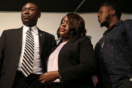 Tiffany Crutcher (C), sister of Terence Crutcher, the Tulsa motorist who was shot and killed by police, stands with attorney Benjamin Crump (L) during a news conference at the Reverend Al Sharpton's National Action Network headquarters in New York, U.S., September 21, 2016. REUTERS/Shannon Stapleton
