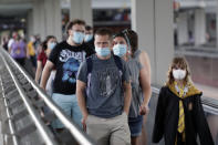 In this Wednesday, June 3, 2020 photo, guests arrive at Universal Orlando Resort Wednesday, June 3, 2020, in Orlando, Fla. The theme park has reopened for season pass holders and will open to the general public on Friday, June 5. (AP Photo/John Raoux)