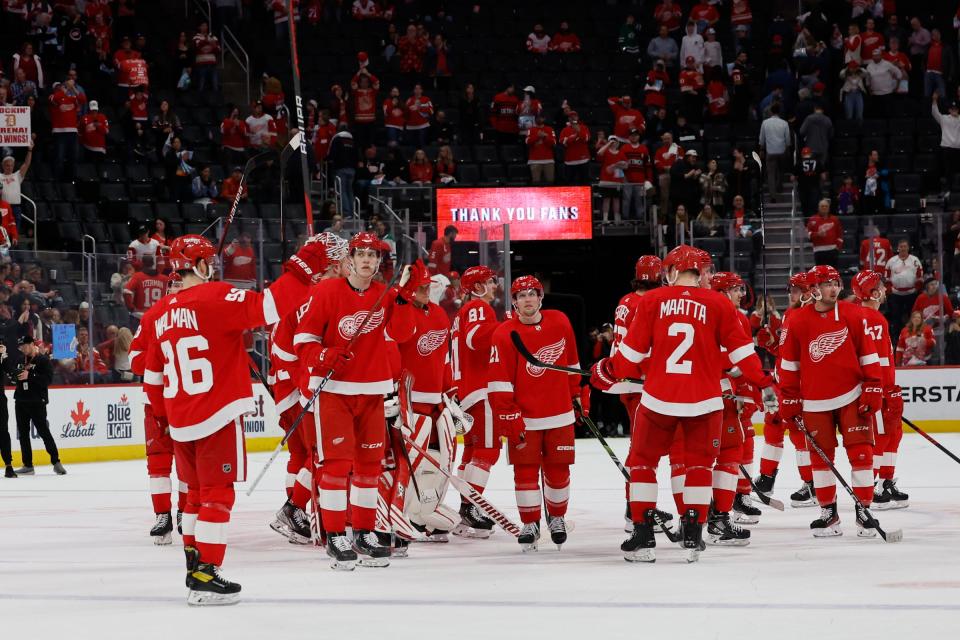 The Red Wings salute their fans after the 6-1 loss to the Stars on Monday, April 10, 2023, at Little Caesars Arena.