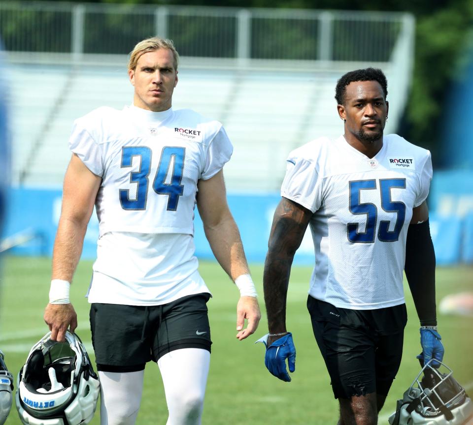 Detroit Lions linebackers Alex Anzalone (34) and Derrick Barnes (55) walk off the field after training camp in Allen Park, Tuesday, July 25, 2023.