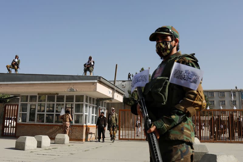 Taliban soldiers stand guard at the second-anniversary ceremony of the takeover of Kabul by the Taliban in Kabul