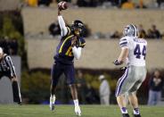 Geno Smith #12 of the West Virginia Mountaineers drops back to pass against the Kansas State Wildcats during the game on October 20, 2012 at Mountaineer Field in Morgantown, West Virginia. (Photo by Justin K. Aller/Getty Images)