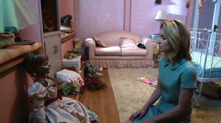 Annabelle Wallis as Mia with the Annabelle doll in "Annabelle." REUTERS/Warner Bros.