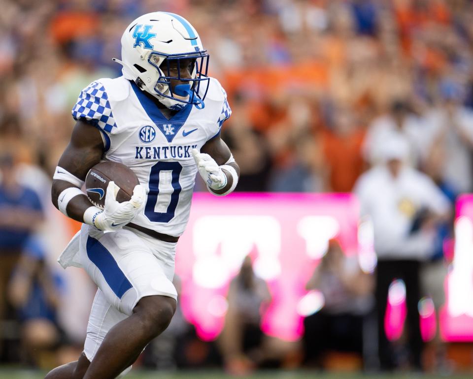 Kentucky Wildcats running back Kavosiey Smoke (0) runs against the Florida Gators in the first half at Steve Spurrier Field at Ben Hill Griffin Stadium in Gainesville, FL on Saturday, September 10, 2022. [Matt Pendleton/Gainesville Sun]