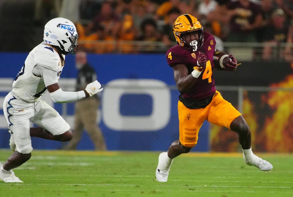 ASU running back Daniyel Ngata (4) sprints downfield against NAU during a game at Sun Devil Stadium in Tempe on Sept. 1, 2022.