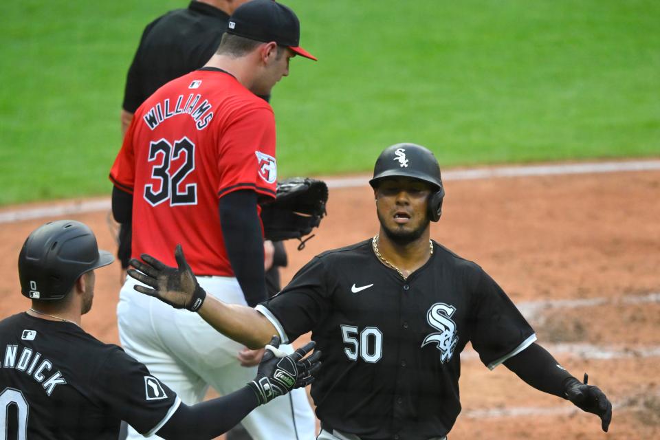 Jul 3, 2024; Cleveland, Ohio, USA; Chicago White Sox third baseman Lenyn Sosa (50) reacts after scoring beside Cleveland Guardians starting pitcher Gavin Williams (32) in the fourth inning at Progressive Field. Mandatory Credit: David Richard-USA TODAY Sports