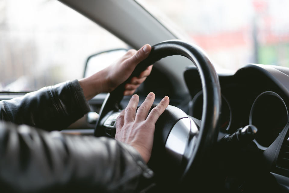 Going to heavy on your horn while driving could end with a hefty fine. A stock image of a man honking horn.