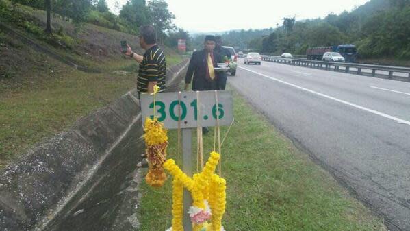 This pic taken from Facebook, shows the Raja Bomoh heading to the highway marker near where the accident which killed Karpal Singh occurred. - April 20, 2014.