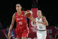 Puerto Rico's Isalys Quinones (25), left, moves the ball up court during women's basketball preliminary round game against Belgium at the 2020 Summer Olympics, Friday, July 30, 2021, in Saitama, Japan. (AP Photo/Eric Gay)