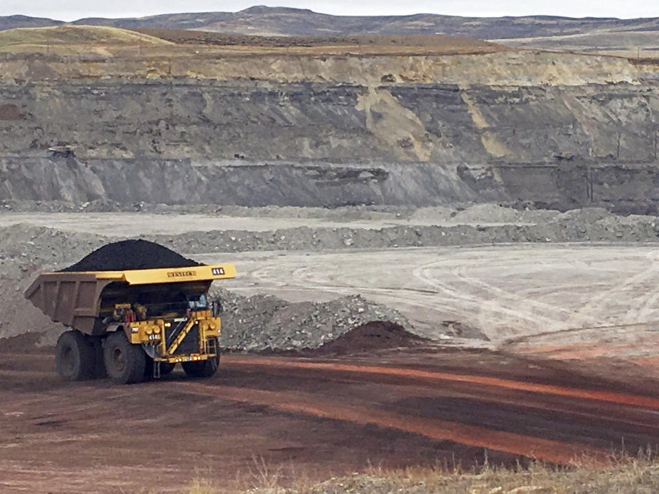 FILE - In this March 28, 2017, file photo, a dump truck hauls coal at Contura Energy's Eagle Butte Mine near Gillette, Wyo. Contura Energy has made a successful bid at auction of $33.75 million for the assets of the Eagle Butte and Belle Ayr mines in Wyoming and Pax Surface Mine in Scarbro, W. Va. They've been closed since Milton, West Virginia-based Blackjewel LLC filed for Chapter 11 bankruptcy protection July 1. (AP Photo/Mead Gruver, File)