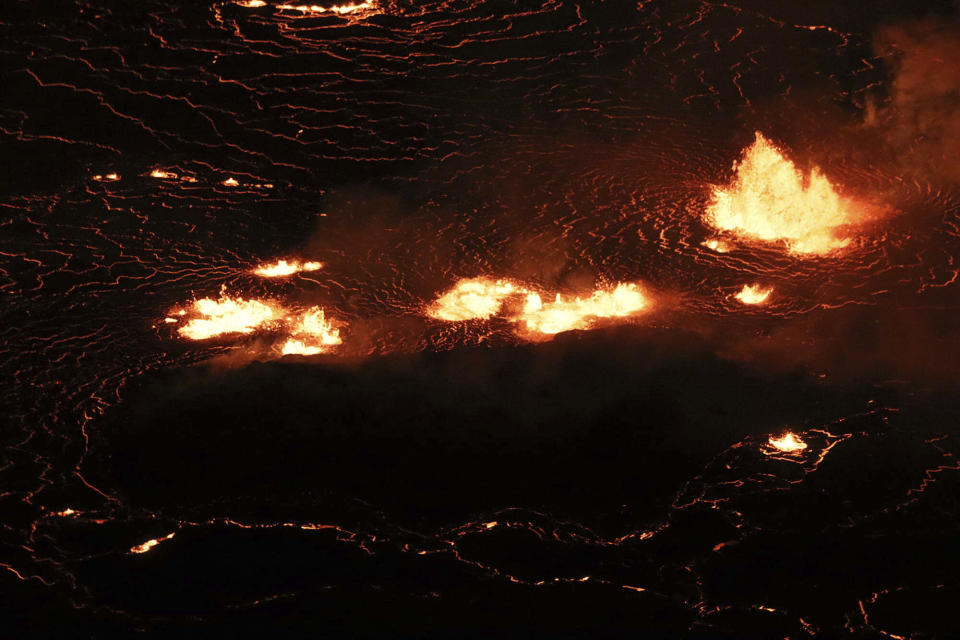 This photo provided by USGS, shows the eruption within in Kilauea volcano's Halemaumau crater at the volcano's summit on Wednesday, Sept. 29, 2021. One of the most active volcanos on Earth is erupting on Hawaii's Big Island. (M. Patrick /USGS via AP)