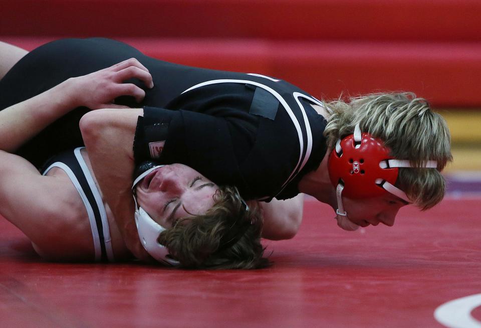 Ballard's Lane Kahler goes foi a pinned Van Meter's Easton Padilla during their 145-pound wrestling in a tri-angle dual meet at Ballard High School's gym Thursday, Jan. 26, 2023, in Huxley, Iowa.