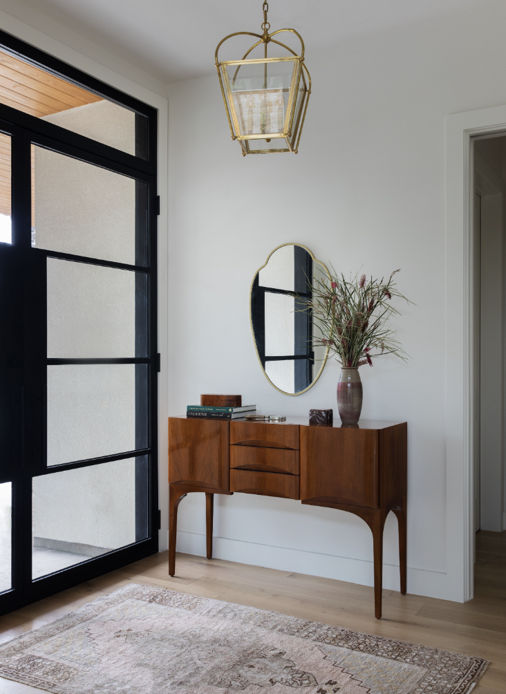 mid century modern table in entryway