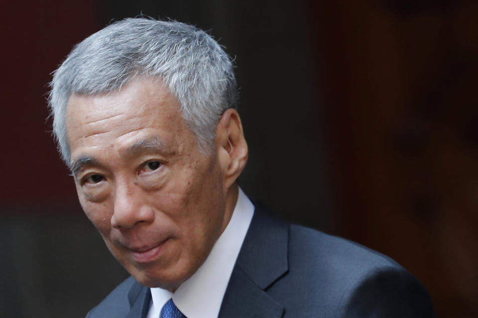 FILE - In this Nov. 19, 2019, file photo, Singaporean Prime Minister Lee Hsien Loong walks at the National Palace in Mexico City. Lee is calling for new elections to seek a new mandate during the coronavirus pandemic. (AP Photo/Marco Ugarte, File)