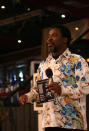 FILE - In this Sunday, Sept. 15, 2013 file photo, T.B. Joshua conducts a service at the Synagogue, Church of All Nations, in Lagos Nigeria. T.B. Joshua's Synagogue, Church of All Nations has branches around the world, and a recent YouTube video even credits him with predicting the disappearance of Malaysian Airlines Flight MH370. Joshua is one of the best-known preachers in Africa and among the most profitable in Nigeria, the go-to faith healer and spiritual guide for leaders such as the late Ghanaian president John Atta Mills, Malawian president Joyce Banda and former Zimbabwean prime minister Morgan Tsvangirai. The man who says he comes from the poor village of Arigidi is worth between $10 and $15 million based on assets, according to Forbes magazine, which in 2011 estimated his personal wealth. The church holds some 15,000 people with outside tents for the overflow and Sunday services are beamed worldwide. Yet critics say this wildly popular televangelist hinders efforts to curtail the spread of HIV and tuberculosis with testimonies by church-goers that faith and his holy water can cure both. He is also accused of taking advantage of his followers and tightly controlling those closest to him, who call him "Daddy."(AP Photo/Carley Petesch, file)