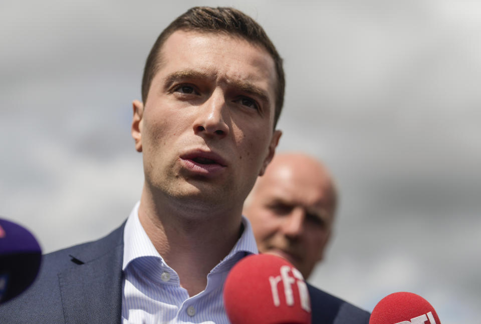 Jordan Bardella far-right National Rally leader for the upcoming election speaks to the media as he visits a farm in Chuelles, 137 kms (85 miles) south of Paris, Friday, June 14, 2024. The election is to take place in two rounds on June 30 and July 7. (AP Photo/Thibault Camus)