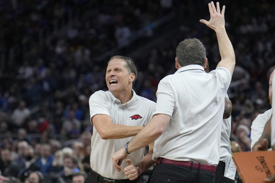 Arkansas head coach Eric Musselman, left, celebrates during the second half of a college basketball game against Gonzaga in the Sweet 16 round of the NCAA tournament in San Francisco, Thursday, March 24, 2022. (AP Photo/Tony Avelar)