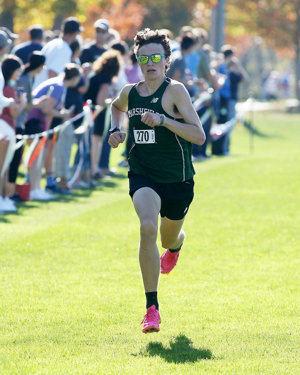Marshfield’s Graham Heinrich sprints to the finish line for second place with a time of 16:12.98 during the Patriot League Championship Meet at Hingham High School on Saturday, Oct. 28, 2023. Plymouth South boys would win with 48 points while Marshfield girls would win with 24 points.