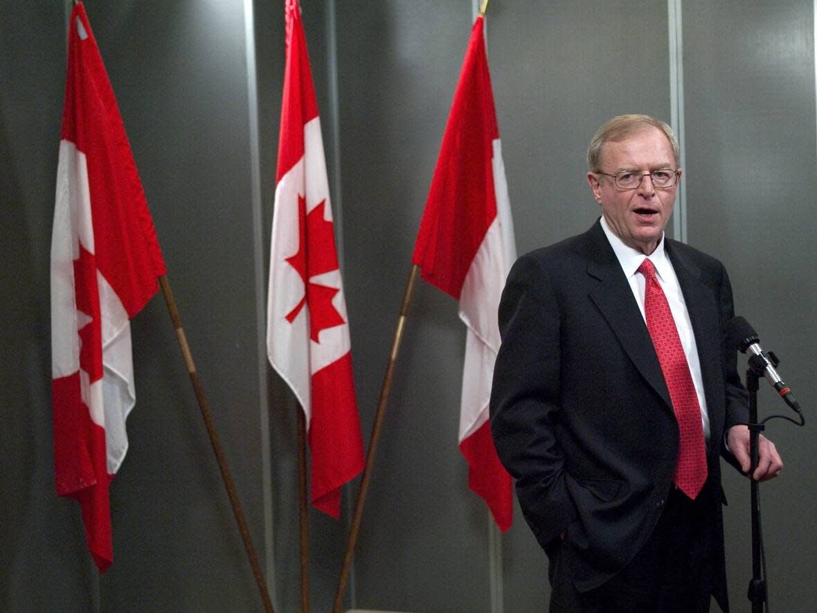 Jim Peterson, MP for Willowdale and Canada's trade minister, speaks to members of the media in Washington, D.C., on Jan. 12, 2004. Peterson's family announced Friday that the now-retired parliamentarian had died at age 82. (Brendan Smialowski/Getty Images - image credit)