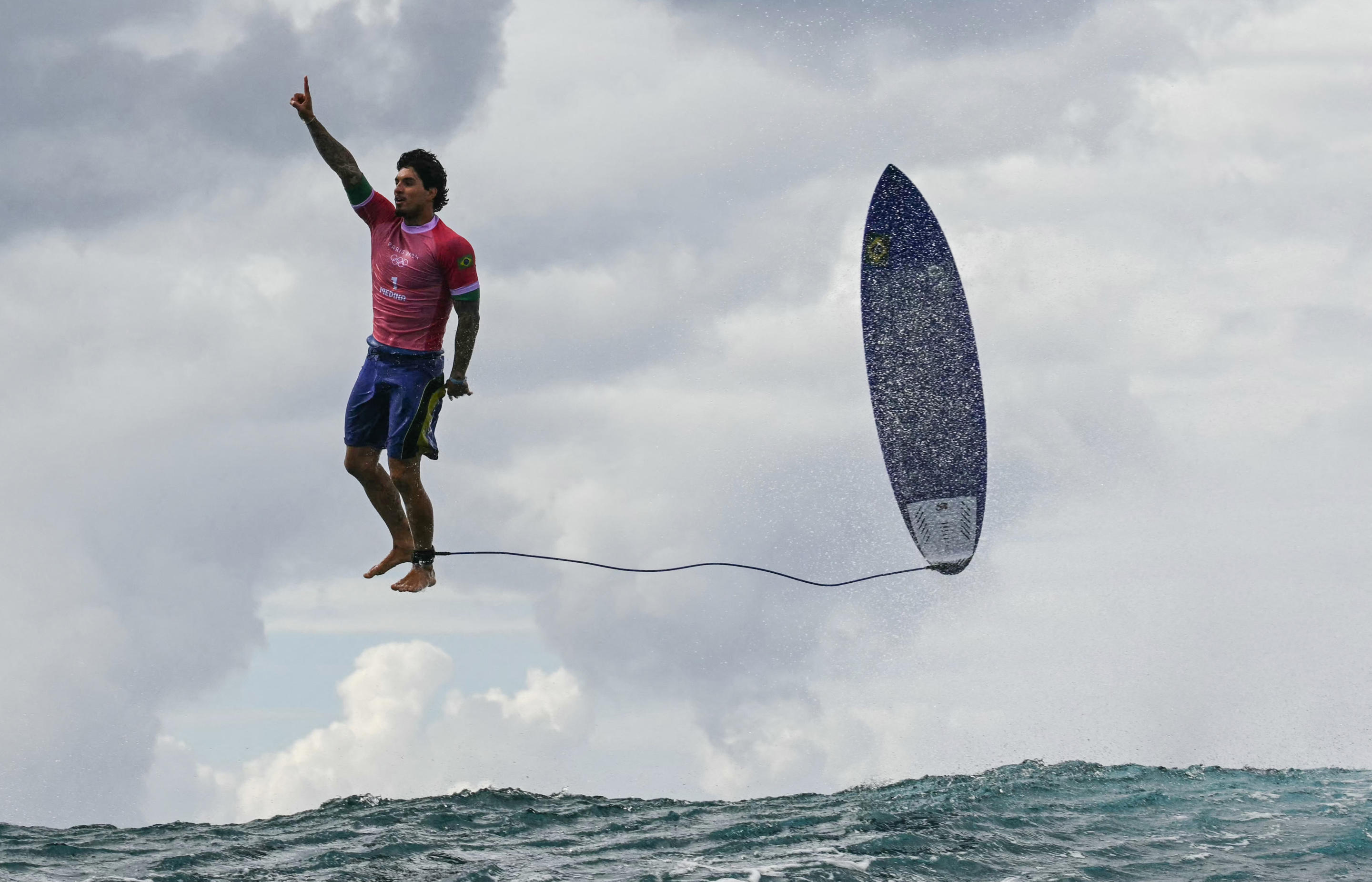 Brazil's Gabriel Medina reacts after getting a large wave in the 5th heat of the men's surfing round 3, during the Paris 2024 Olympic Games, in Teahupo'o, on the French Polynesian Island of Tahiti, on July 29, 2024. (Jerome Brouilette/AFP via Getty Images)