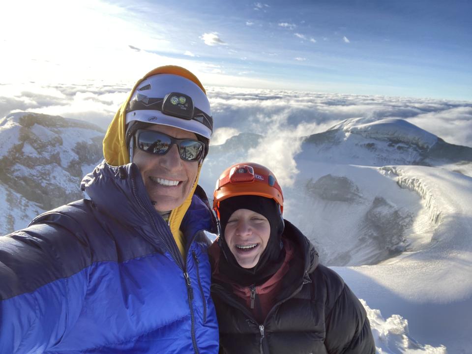 Martin Frey, left, and Brecken Paul, 14, pose for a photo at the summit of 19,500-foot Cotopaxi, a stratovolcano in Ecuador. After successfully climbing the Seven Summits and sailing the Seven Seas, Frey has turned his attention to encouraging young people to get outside and have adventures. | Martin Frey